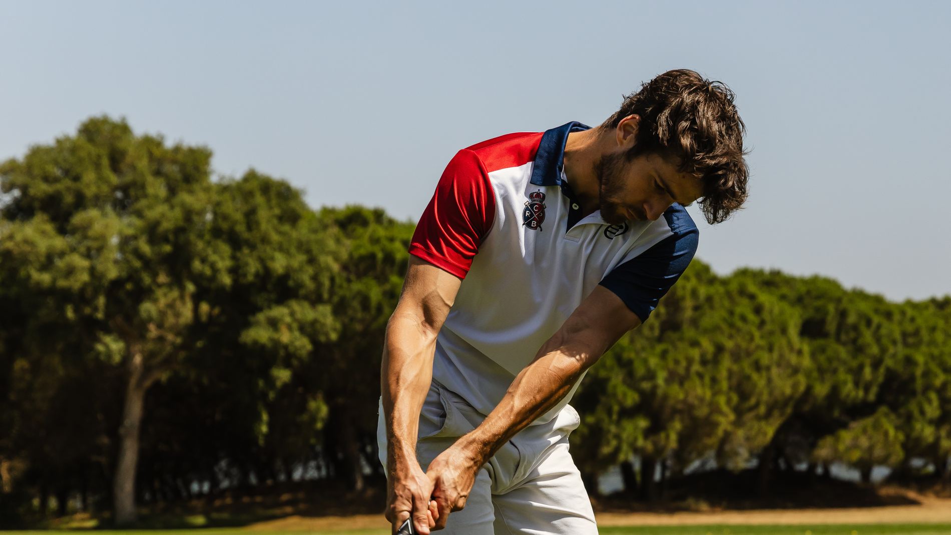 Golfer mid-swing with TruLink Tempo Stick - desktop hero